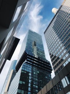 looking up at skyscrapers from the ground