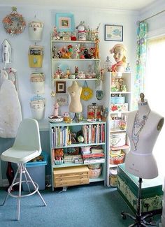 a room filled with lots of different items on shelves next to a chair and window