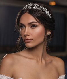 a beautiful woman wearing a tiara and diamond jewelry