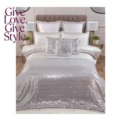 a bed covered in silver sequins and pillows