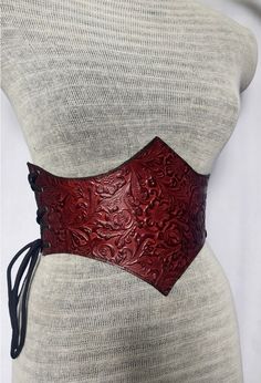 "It is Handmade leather corset with embossed beautiful designs. Handmade and hand dyed belt with high quality leather. It is adjustable with lace.  MEASUREMENTS: S/M : 66 cm - 74 cm / 26\" in - 29\"in M / L: 75 cm-85 cm / 29.5 \"in - 33.5\" in L / XL: 85 cm-95  cm / 33.5 \"in - 37.4\" in XXL: 95 cm-105 cm / 37.4 \"in - 41.3\" in DETAILS: ► 100% handmade ► 100% genuine leather ► Made on your measurements ► Unique design ► Battle ready ► LARP standard ► Worldwide delivery NOTE: This item can be personalized on request (contact us) We remind our customers that you can find the MEASURES of the items in the description. It is your responsibility to read and make sure the item fits your measurements before making a purchase. In case of doubt, you can ask us about the measurements before buying t Larp, Corset Diy, Leather Corset Belt, Corset Belt, Leather Corset, Suspender Belt, Fantasy Clothing, Handmade Leather, High Quality Leather