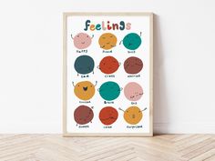 a poster with the words feelings in different colors and sizes, on a wooden floor