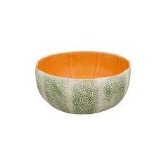 an orange and white bowl with spots on it's rim, in front of a white background