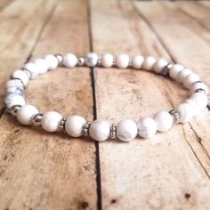 Bracelet Made With 6mm White Howlite Gemstone Beads And Silver Spacer Beads On Elastic Cording. Howlite Bracelet, White Howlite, Spacer Beads, Womens Jewelry Bracelets, Bracelet Making, Gemstone Beads, Women Jewelry, Elastic, Bracelet