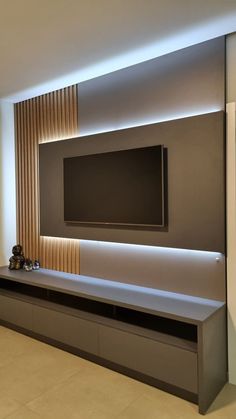 a flat screen tv mounted to the side of a wall