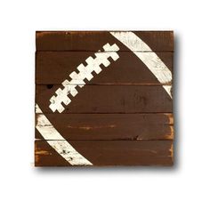 a wooden sign with a football painted on it