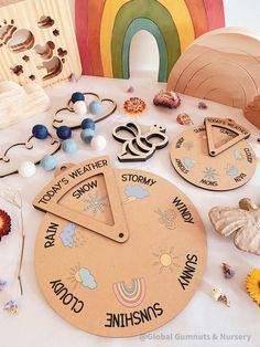 a table topped with lots of different types of wooden toys and magnets on top of it