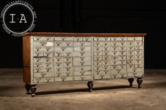 an old metal filing cabinet with lots of drawers