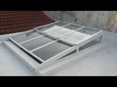 an open window sitting on top of a roof