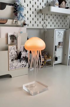 Dancing Tentacles  This lamp rotates gently, making the flowing legs look like a real jellyfish in motion.  It has a soft, calming light that can change colors, creating a soothing effect in any room.  Soothing Glow  Easily change the colors of the lamp to match your mood or room decor. Enjoy a variety of colors for different vibes, from relaxing blues to energizing reds.  Rechargeable and Portable  Powered by USB-C, this lamp is easy to recharge and move around, letting you set a relaxing vibe Floating Jellyfish, Jellyfish Light, Jellyfish Lamp, Fish Lamp, Room Goals, Night Light Lamp, Trendy Decor, Unique Lighting, Underwater World