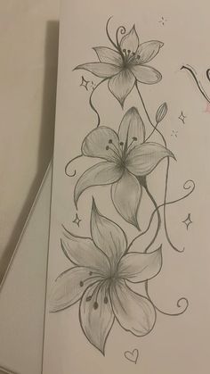 a drawing of some flowers on a piece of paper