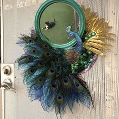 there is a mirror with a peacock on it