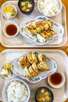 two trays filled with different types of food