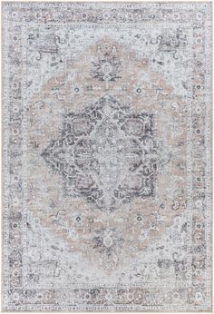 an antique style rug in grey, beige and white colors with a medallion design on the center