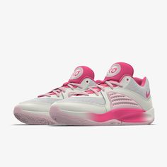 a white and pink tennis shoe on a white background