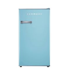 a blue refrigerator freezer sitting on top of a white floor next to a wall