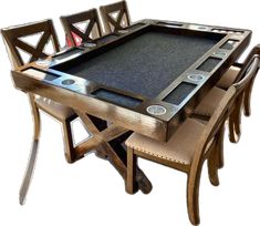 a wooden table with chairs around it and a black tray on the top that is holding a game board