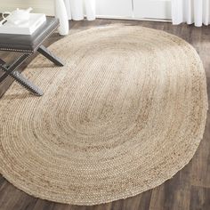 a large round rug on the floor in a living room