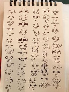 a sheet of paper that has some drawings on it with eyes and mouths drawn on it