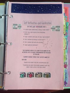 a pink binder with instructions for self reflection and conversation in the last words on it