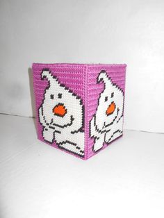 a pink and white beaded box with an image of a dog on it