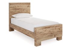 a wooden bed frame with white sheets and pillows