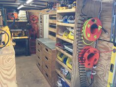 the inside of a woodworking shop with various tools and supplies on shelves, including pliers