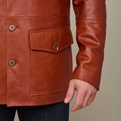 This rugged Safari Leather jacket is a vintage look that is sure to keep you warm while you brave the cold. Adorned with two upper pockets and two lower pockets, this piece enables you to pack as heavy or light in the cold as you like. Layer this Safari Jacket with a lightweight sweater or simple button down to achieve a dynamic look of western sophistication. Model is 6'1 and wearing size M. Brown Utility Sport Coat With Patch Pockets, Rugged Leather Jacket With Pockets For Winter, Brown Utility Jacket For Cold Weather, Classic Utility Jacket With Multiple Pockets And Lapel Collar, Rugged Brown Utility Jacket With Pockets, Rugged Outerwear With Patch Pockets For Work, Brown Winter Utility Jacket With Pockets, Classic Hunting Outerwear With Flap Pockets, Rugged Brown Sport Coat For Work