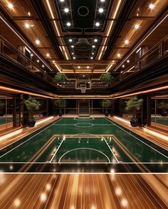 a large indoor basketball court with lights on the ceiling and wood flooring around it