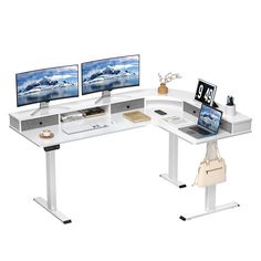 a computer desk with two monitors and a purse