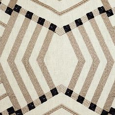 a white and black area rug with an abstract design on the bottom, in front of a beige background