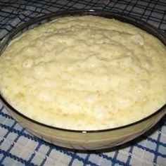 a bowl filled with batter sitting on top of a blue and white checkered table cloth