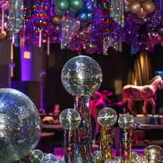 disco balls and mirrors are on display at a party