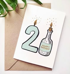 a birthday card with the number two on it and a bottle of booze next to it