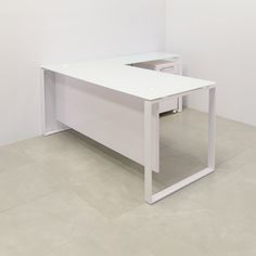 a white desk with two drawers in an empty room