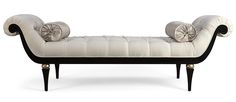 a white and black bench with two pillows on it's back end, sitting in front of a white background