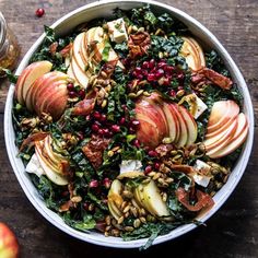 an apple salad with nuts and cranberries in a bowl