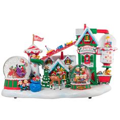 a christmas village with snow globes and santa's workshop