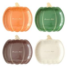 four pumpkin shaped plates in different colors