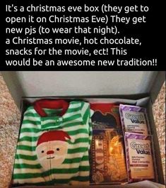 an open box filled with christmas items on top of a carpet