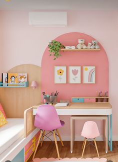 a child's room with pink walls and wooden flooring, two children's desks