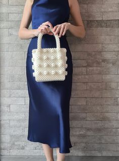 Shrimps bag Aesthetic tote bag for woman. Vintage pearl beaded white retro bag that will decorate your wedding day. Amazing wedding gift for bride. SIZE: *Height: 33 cm *Height without handles: 19 cm *Width: 16.5 cm *Lateral width: 10 cm *Handle drop: 14 cm *Weight: 750g ❗️OTHER COLORS❗️ *BLACK shrimps bag* https://vitakajewelry.etsy.com/listing/834204172 *PINK shrimps bag* https://vitakajewelry.etsy.com/listing/856019437 *CLEAR shrimps bag* https://vitakajewelry.etsy.com/listing/1254148624 🔥PROCESSING TIME 3-4 days MATERIAL: white acrylic pearl beads 8mm. LINING White satin🤎 The bag can be made with a LINING with a POCKET or without a lining. Choose VARIATIONS when you place an order☝ With every pearl bag you'll get jewelry GIFT  In addition to the gift, a hand-signed POSTCARD with a me White Tote Bag With Pearl Handle, White Top Handle Evening Bag, Cream Top Handle Bag With Pearl Detail, Cream Top Handle Bag With Pearl Handle, White Double Handle Box Bag For Gift, White Double Handle Box Bag Gift, Elegant Beige Evening Bag As Gift, Elegant Beige Evening Bag For Gift, Elegant White Top Handle Evening Bag