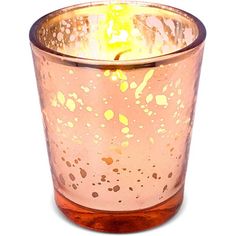 a pink glass candle holder with gold speckles and a yellow light in the middle