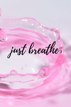 a pink water drop with the words just breathe above it