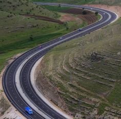 an aerial view of a highway in the country