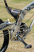 a close up view of the front end of a mountain bike with its brake assembly missing