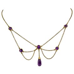 THIS IS A STUNNING VICTORIAN - ART NOUVEAU - BELLE EPOQUE FESTOON NECKLACE WITH THE MOST GORGEOUS NATURAL ROUND AND BRIOLETTE CUT SIBERIAN AMETHYST GEMS SET IN A GORGEOUS OPEN WORK FESTOON SWAG DESIGN IN 14 KARAT ROSE GOLD DATING TO CIRCA 1880. These festoon necklaces are so lovely and hang beautifully around the neck. The color of these Amethysts is an extraordinary vivid royal purple! The design is full of the delicate romance of the age and is so special with the amethysts which are all the r Victorian Jewelry Tattoo, Siberian Amethyst, Womens Necklaces Silver, Victorian Pendant Necklace, Cuff Tattoo, Briolette Necklace, Festoon Necklace, Gold Drop Necklace, Diamond Drop Necklace