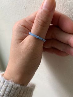 Perfect beaded ring to add to your stack or on its own!  Made with strong 0.5 elastic and white glass seed beads.  *Note that because of the size of the bead hole and the thickness of the elastic, the knot that was made cannot fully be hidden.* Please see the last photo for a closeup of the ring with the knot. Blueberry Seed Bead Ring, Blue Beaded Rings, Seed Bead Rings, Beaded Ring, Silver Line, Some Girls, Glass Seed Beads, Beaded Rings, Wedding Color Schemes