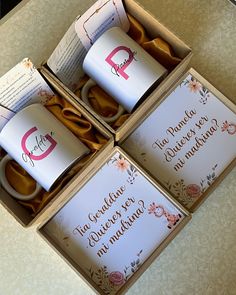 three coffee mugs in a box on a table