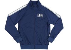 a blue track jacket with white stripes on the sleeves and chest, featuring an j logo